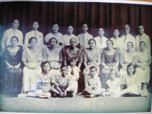 Family photo of the despedida for Avelina Ocampo (Sr. Mary Assumption) who is seated fourth from right.